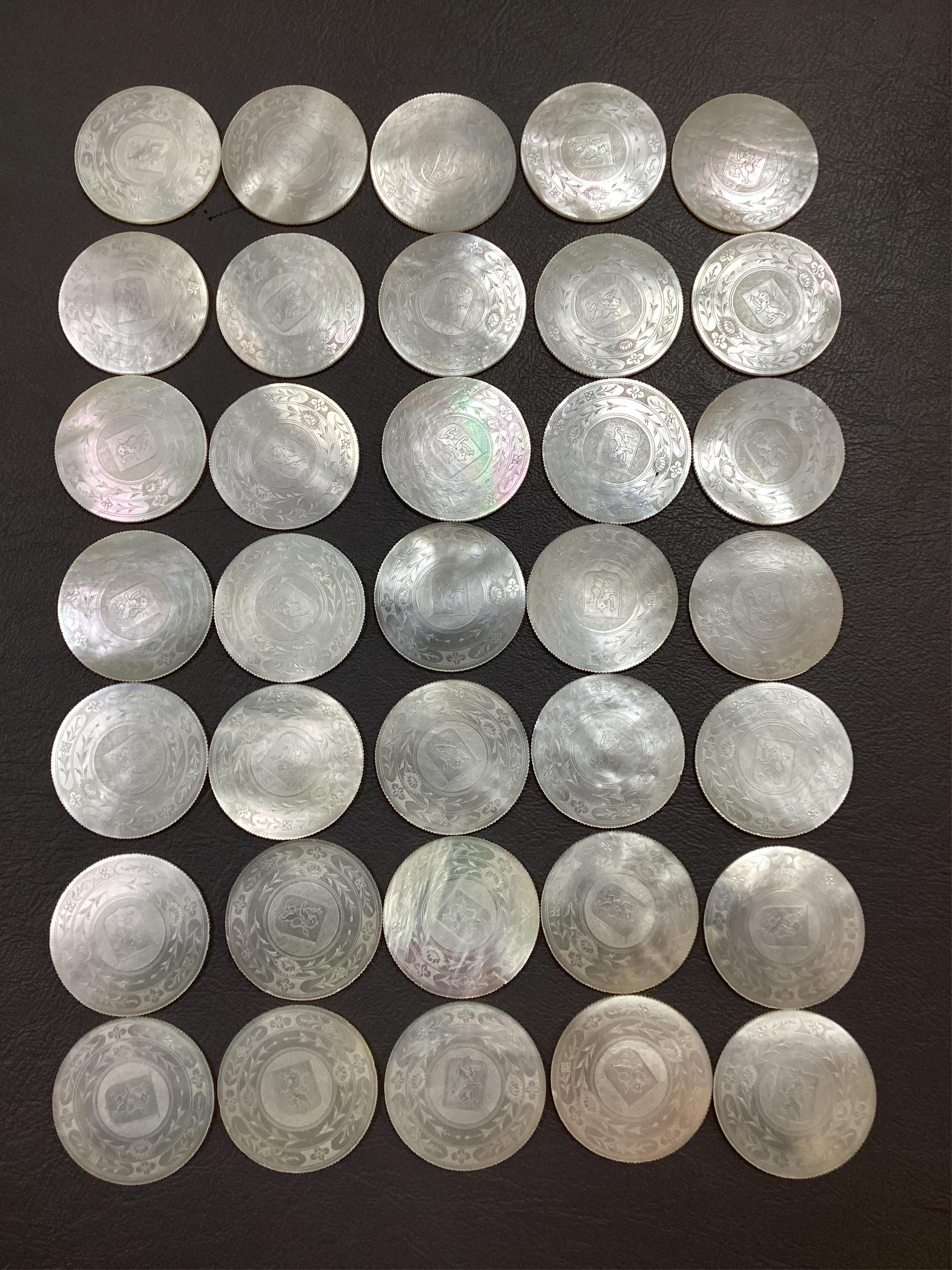 Two Chinese gilt decorated black lacquer games boxes, containing numerous mother-of-pearl counters, 19th century